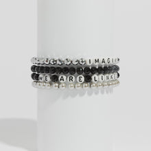 Load and play video in Gallery viewer, Gloria Steinem We Are Linked Not Ranked Bracelet (Black)